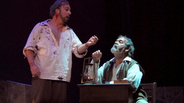 Tosca - Festival Opera;
Robert Breault as Cavaradossi and Paul Cheak as the jailor. trading his ring